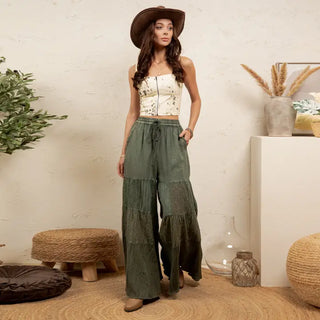 Wide-leg pants in basil with a 4-tier patchwork design, modeled with a fitted top.