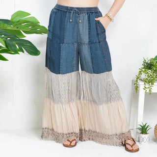Boho-inspired denim pants with patchwork design in latte color, featuring an elastic waist and full-length cut.