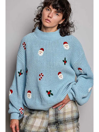 Light blue chenille sweater with holiday motifs and a mock neckline.