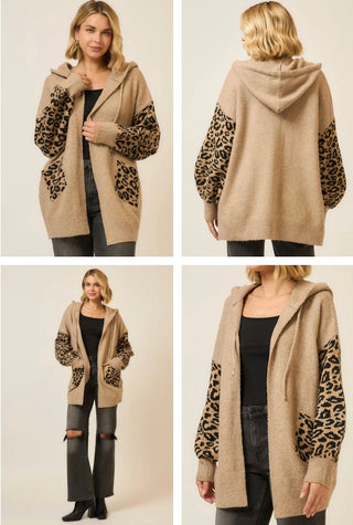 Mocha hooded cardigan with leopard-print sleeves and pockets, open front, worn by a model over a black top and dark jeans.