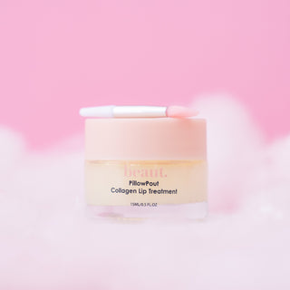 A jar of beaut. PillowPout Collagen Lip Treatment with a pink lid and applicator, set against a soft pink background.
