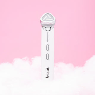 DermaLuxe SculptPro, a sleek white skincare tool with LED light and control buttons, set against a soft pink background.