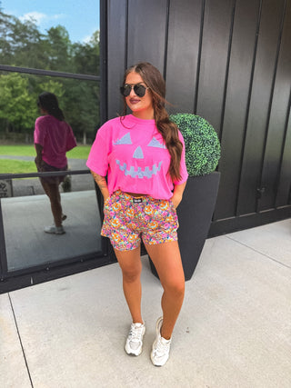Checkered Pumpkin Face Graphic Tee on Neon Pink
