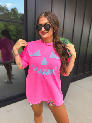 Checkered Pumpkin Face Graphic Tee on Neon Pink