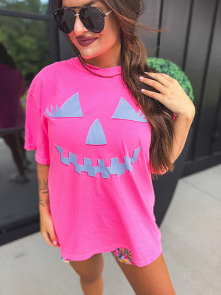 Checkered Pumpkin Face Graphic Tee on Neon Pink