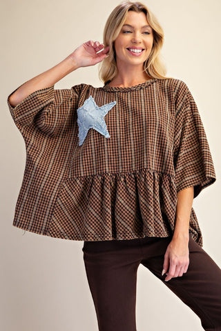Mocha plaid top with a star patch detail and relaxed fit.