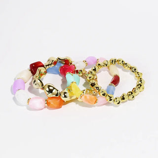 Bracelet set with multicolored beads and gold-toned accents in a stretch design.