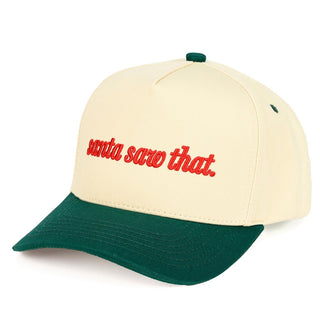 Cream baseball cap with green brim and red 'Santa Saw That' embroidery.