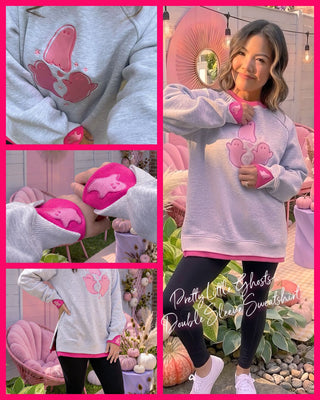 Gray sweatshirt with pink ghost motifs and Layerpop™ Double Cuffs worn by a person.