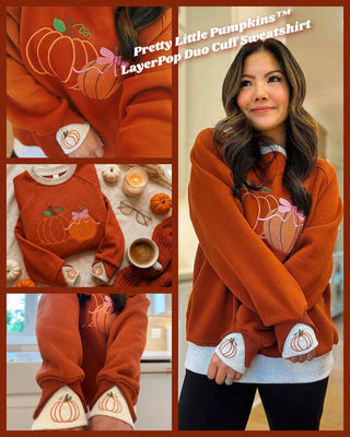 Orange sweatshirt with pumpkin embroidery and layered cuffs.