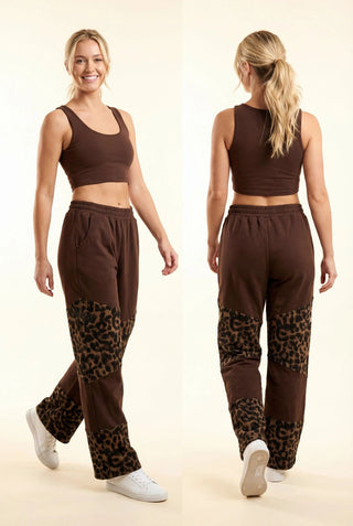 Model wearing brown wide leg pants with leopard print patchwork detail, paired with a brown tank top.