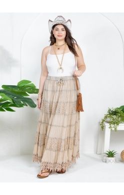 Woman wearing a long, flowing latte-colored skirt with a 7-tier crinkle lace design.