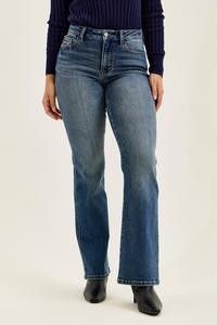 Judy Blue Mr. Daisy Bootcut Jeans in Dusk Rider Indigo shown on a model with a fitted top and ankle boots.