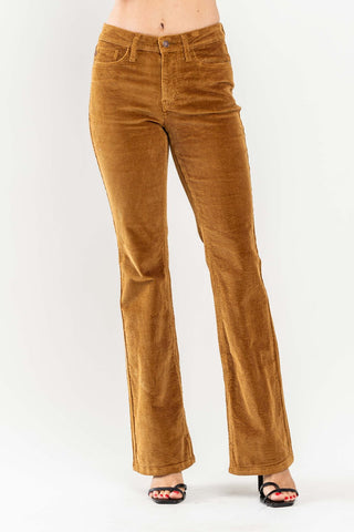 Camel-colored corduroy bootcut pants with a fitted waistband and button closure.
