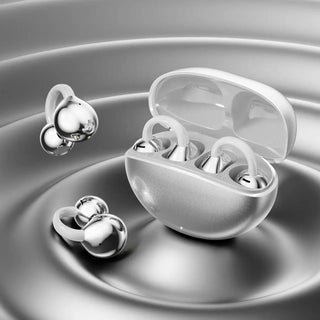 Open ear clip-on earbuds in silver with a charging case.