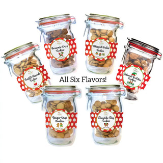 Six mason jars filled with assorted Christmas cookies, each labeled with different flavors.