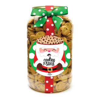 A festive gallon jar filled with chocolate chip cookies, adorned with a Santa-themed label and a polka dot ribbon.
