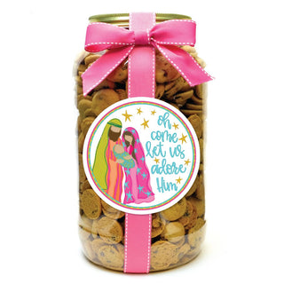 A gallon jar filled with cookies, featuring a festive 'Oh Come Let Us Adore Him' design and a pink ribbon.