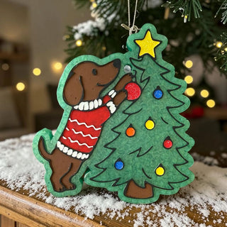 Holiday freshie featuring a dog in a red sweater reaching for a decorated Christmas tree.