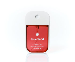 Touchland Power Mist Hand Sanitizer in Cranberry Fizz fragrance with 1 fl oz (30 ml) volume in a sleek red bottle.