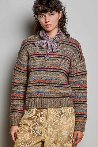 A woman wearing a striped brushed knit sweater in choco multi with a crew neck and drop shoulders.
