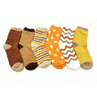 A set of plush feather-knit crew socks in brown, orange, and yellow with various patterns like stripes and polka dots.