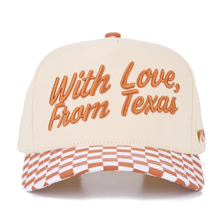 Cream baseball cap with orange 'With Love, From Texas' embroidery and camo pattern on the brim.