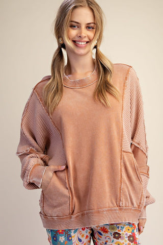 A relaxed fit pullover in almond color with thermal mix design and washed terry fabric.