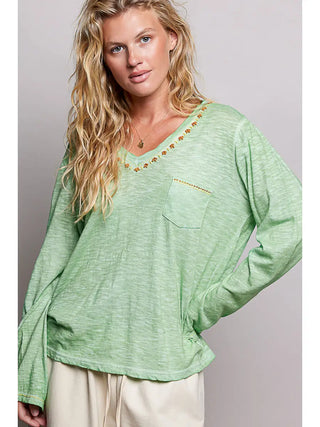 Green textured knit top with hand-stitched V-neck and pocket detail.