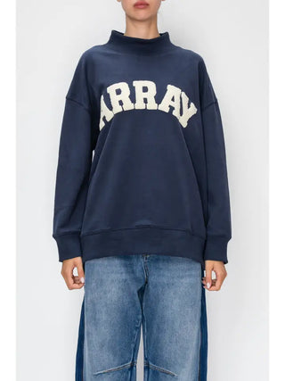 Navy pullover with mock neck and bold graphic lettering across the chest.