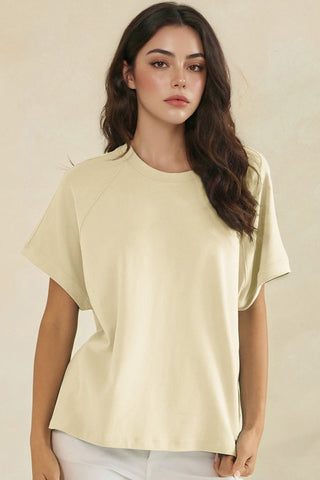 Relaxed off-white raglan style short sleeve top with a crew neck.