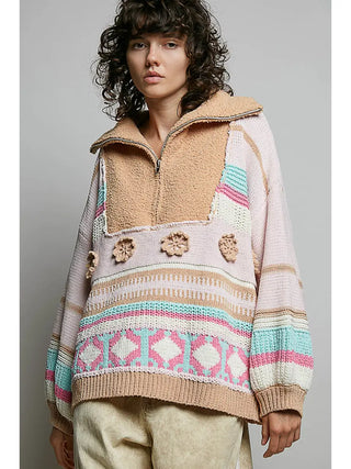 Pullover sweater with a high collar, half zipper, and ethnic color block pattern in blush multi hues.