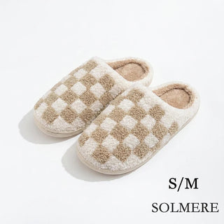 Cream checkered plush slide-on slippers with a cozy design.