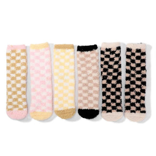 A set of plush knit crew socks with a checker pattern in pink, cream, and black.