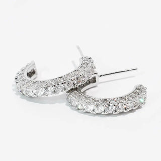 Silver hoop earrings with rhinestone embellishments and post back closure.