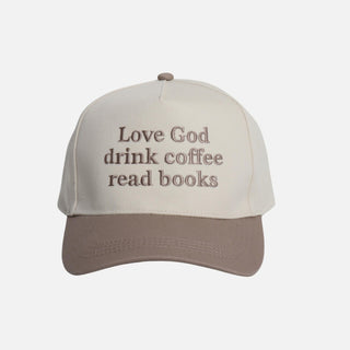 Cream and brown two-tone baseball cap with the embroidered message 'Love God, drink coffee, read books'.