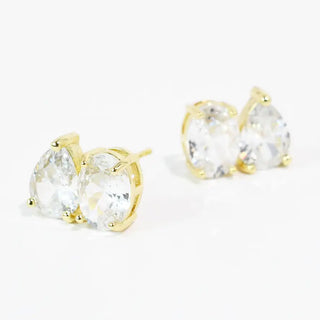 Gold stud earrings featuring cubic zirconia stones in a double setting.