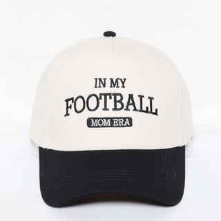 A white and black two-tone baseball cap with 'In My Football Mom Era' embroidered on the front.