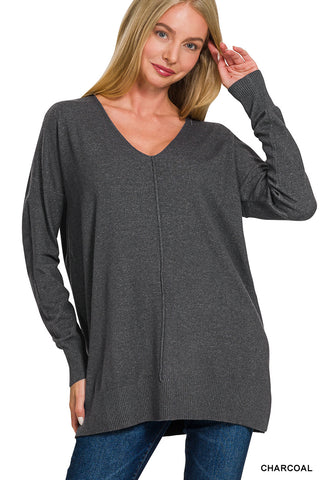 Charcoal sweater with a front seam detail, long sleeves, and a relaxed fit.
