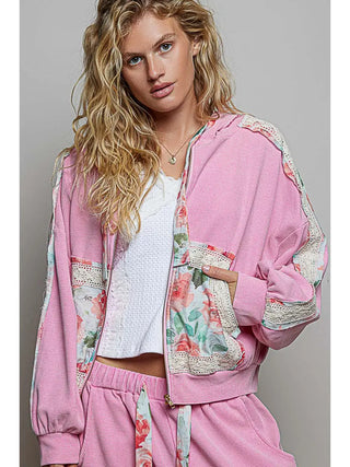 Hooded jacket in candy pink with floral and lace accents, featuring a front zip and front pockets.