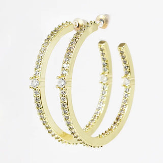 Gold hoop earrings with crystal embellishments and post back closure.