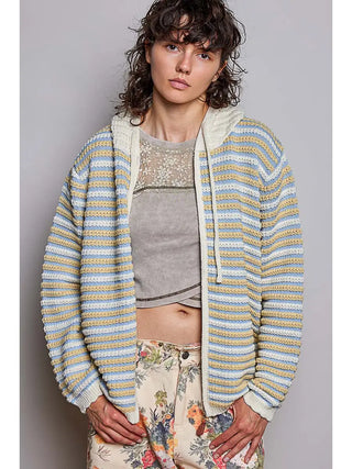 A multicolor striped knit cardigan hoodie with a zip-up closure and attached hood in cream, blue, and yellow.