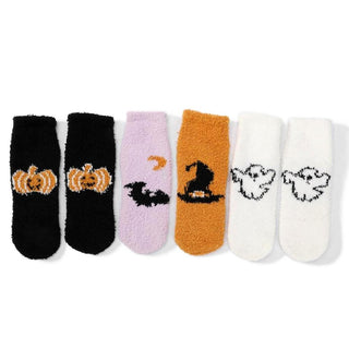 Three pairs of plush knit socks with Halloween designs in black, purple, orange, and white colors.