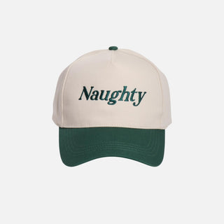 A two-tone baseball cap in cream and green with 'Naughty' embroidered on the front.
