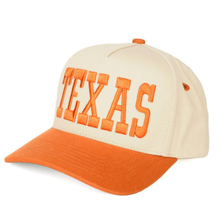 Two-tone baseball cap in cream and orange with 'Texas' embroidered in bold letters.