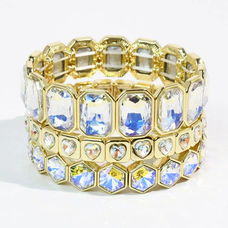 Gold-tone bracelet stack with iridescent multicolor stones.