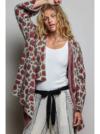 Leopard pattern mohair sweater open cardigan in olive and cherry worn over a white top.