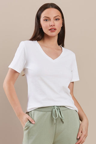 White cotton T-shirt with a V-neck and short sleeves, worn by a model.