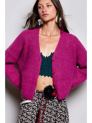 A plum berry long sleeve V-neck button-down sweater cardigan worn by a model.