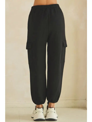 Black relaxed cargo jogger pants with an elastic waistband and side pockets.